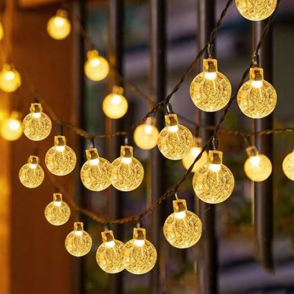 LED solarni dekorativni lanac 50xLED/8 funkcija 500 mAh 9,5 m IP67 topla bijela